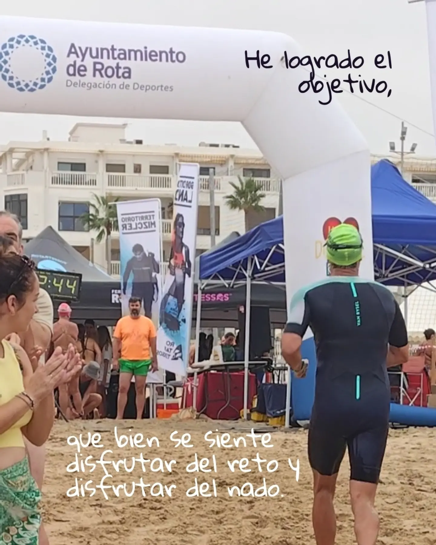 Finishing under the arch of the open water swim in Rota.